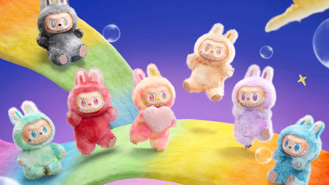 Colorful plush toys in bunny costumes on a rainbow with a starry sky background